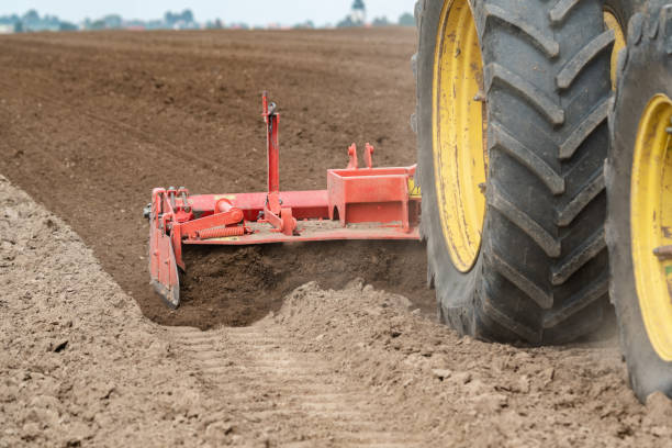 istock Tractor harvester working on the field 1001133726
