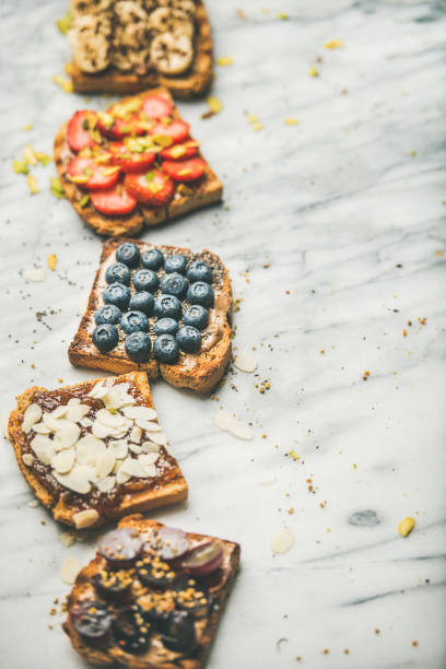 istock Vegan whole grain toasts with fruit, seeds, nuts 1001139472