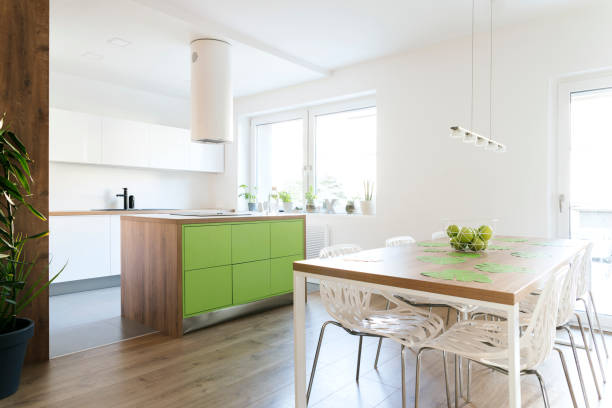 istock Modern and design scandinavian kitchen with plants and accessories . Sunny and bright space with white wall. 1001153878