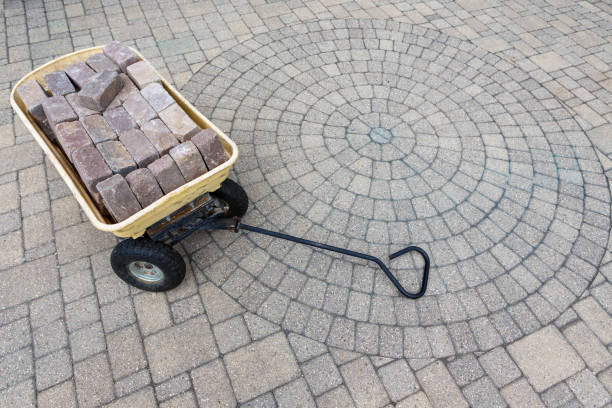 istock Trolley filled with paving bricks on a patio 1001171146