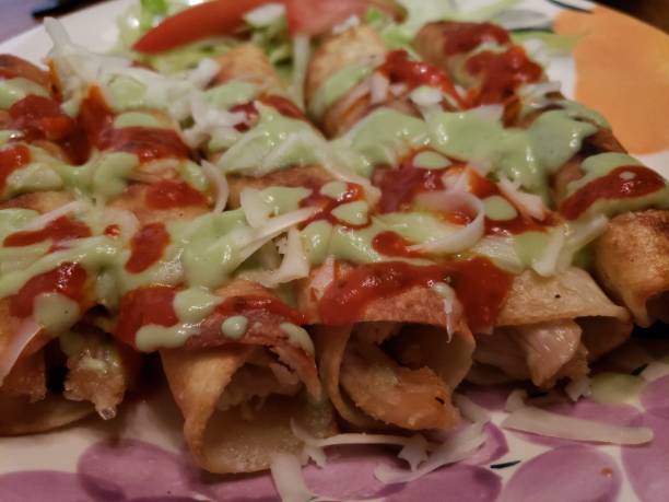 istock Chicken flautas with avocado cream sauce 1001171210
