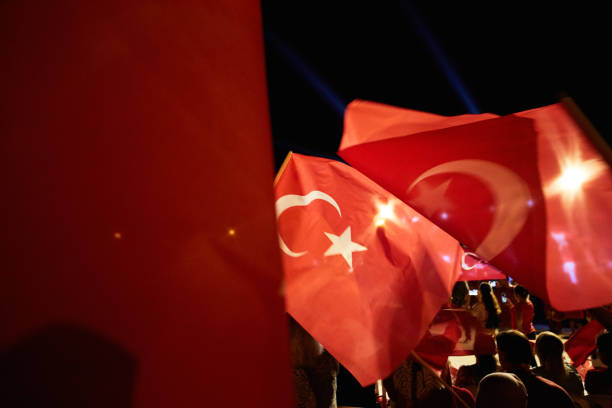 Izmir - Turkey - July 15, 2018: The celebration of democracy in Turkey. There are Turkish flags in the hands of people and in Fethiye Cumhuriyet Square. Democracy and National Unity Day, celebrated every year on July 15 in Turkey