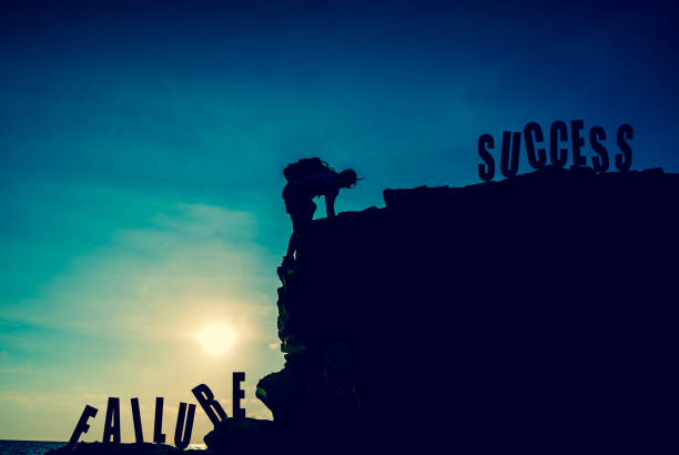 Business success and goal concept. Silhouette climber on the cliff. Business success and goal concept. Silhouette climber on the cliff. chief leader photos stock pictures, royalty-free photos & images