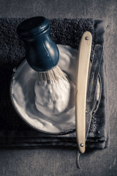 istock Old barber equipment. Sharp razor, soap and brush 1001193582
