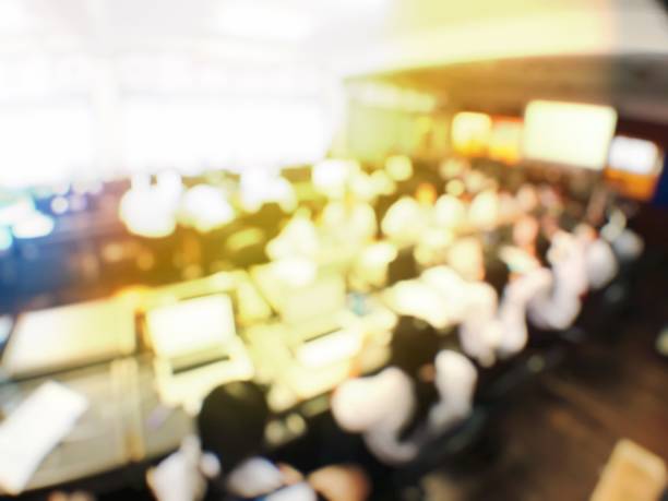 istock Blurred image of group of students are learning and lecture and using computer together in classroom for study and workshop in computers room at school. education technology or training concept. 1001207664