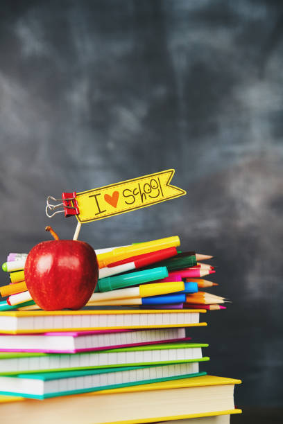 istock Back to school supplies against weathered chalkboard 1001214914