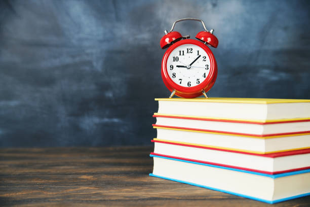 istock Back to school background with books and clock 1001225164