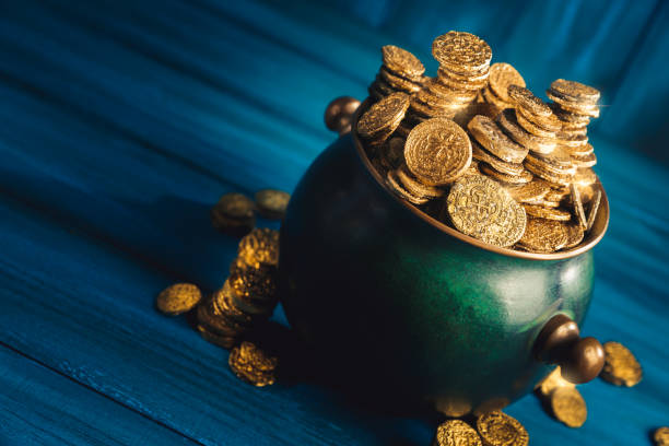 istock Green pot of gold in a dark background 1001225220