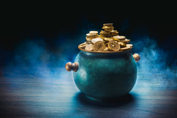 istock Green pot of gold in a dark background 1001255480