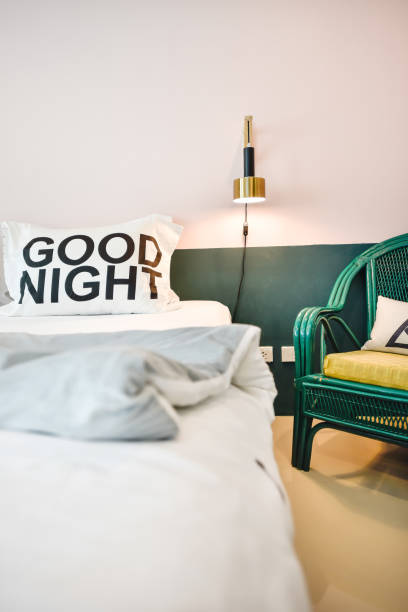 istock Modern bedroom interior with comfortable pillow and decorative lamp 1001286284
