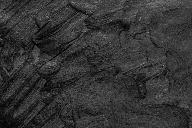 istock Black brush strokes on white paper isolated 1001288922