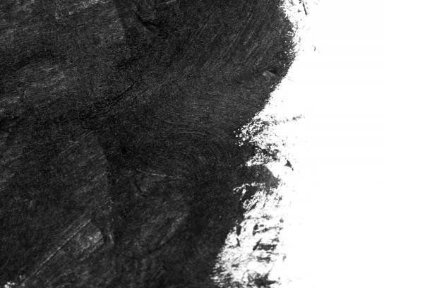 istock Black brush strokes on white paper isolated 1001288984