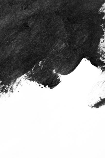 istock Black brush strokes on white paper isolated 1001289144