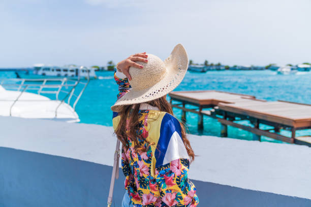 istock Beautiful woman looking sea view. 1001289254