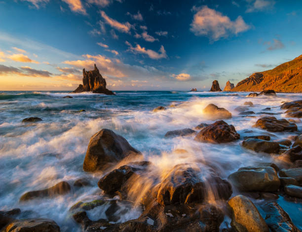 istock beautiful sunset on the ocean beach, Benijo beach, Tenerife 1001292006