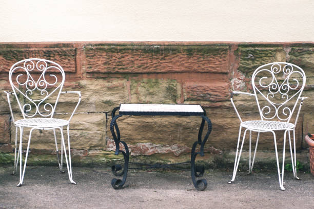 istock Empty street cafe with two white chairs and tables. Front view. 1001298534