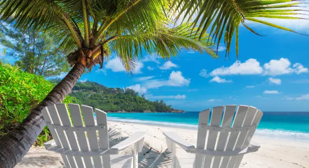 Photo of Beach chairs on tropical beach