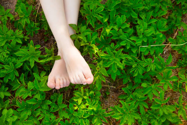 istock Young adult feet resting on the grass 1001327204