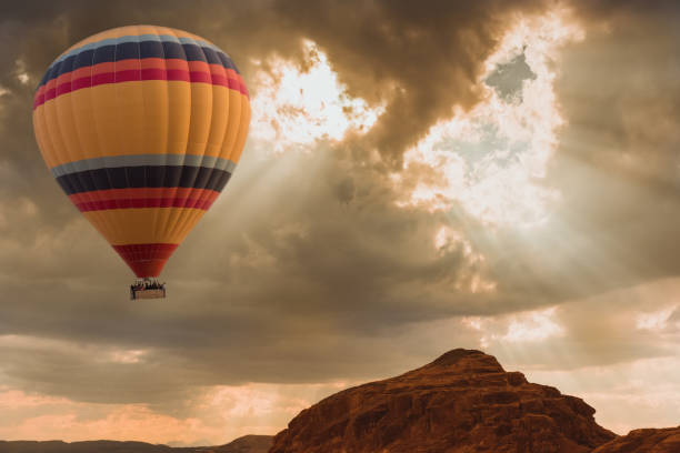 istock Hot Air Balloon travel over desert 1001335354