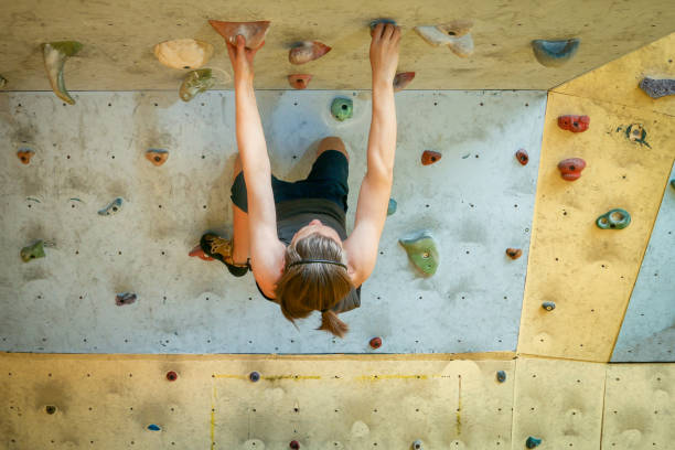 istock Teenage Boy Training Climbing On Indoor Climbing Wall 1001335884