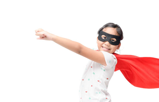 istock Little child plays superhero isolated on white 1001339308
