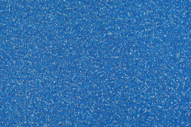 istock blue sparkling glitter texture background.holiday festive backdrop. 1001339456