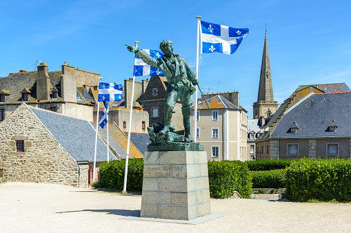Saint-Malo, France - June 21, 2018: The bronze statue of french privateer Robert Surcouf, born in Saint-Malo, is an artwork by Alfred Caravanniez and was erected in Place du Quebec in 1903.