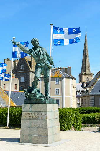 Saint-Malo, France - June 21, 2018: The bronze statue of french privateer Robert Surcouf, born in Saint-Malo, is an artwork by Alfred Caravanniez and was erected in Place du Quebec in 1903.