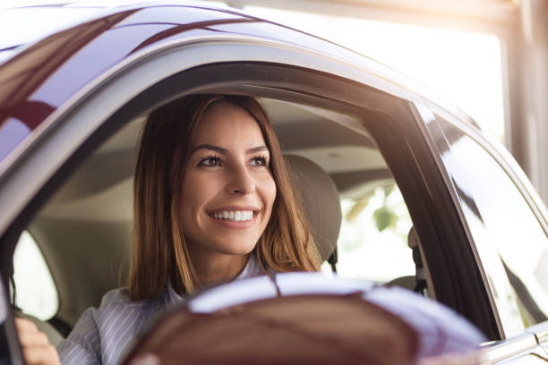 istock Young woman buying a car 1001345614