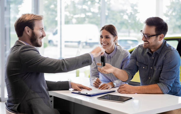 istock Buying a car in auto salon 1001345956