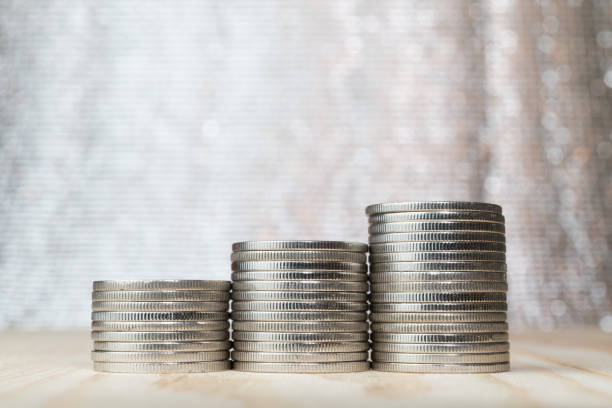 istock close up three stacks of coin with bokeh background 1001346362