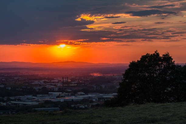 istock Nice sunset over city Ceske Budejovice with tree silhouette 1001346404