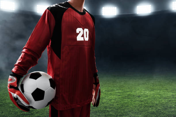 istock Soccer goalkeeper holding soccer ball 1001350406