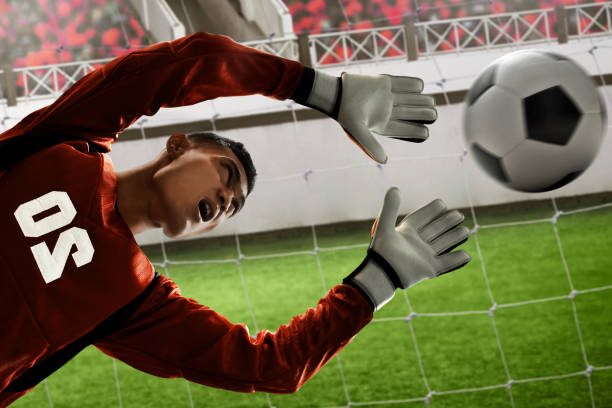istock Soccer goalkeeper catches the ball 1001350638