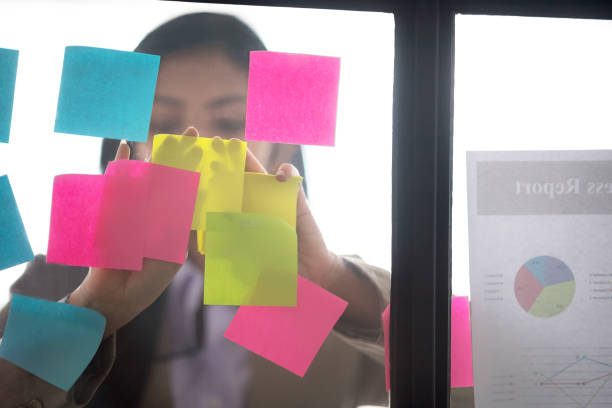 istock Businesswoman putting her ideas on glass. 1001353196