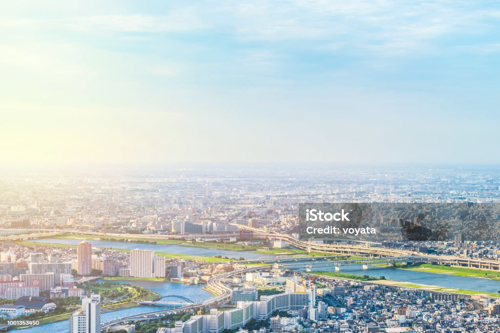 panoramic modern city urban skyline bird eye aerial view under sun & blue sky in Tokyo, Japan Asia Business concept for real estate and corporate construction - panoramic modern city urban skyline bird eye aerial view under sun & blue sky in Tokyo, Japan City Stock Photo