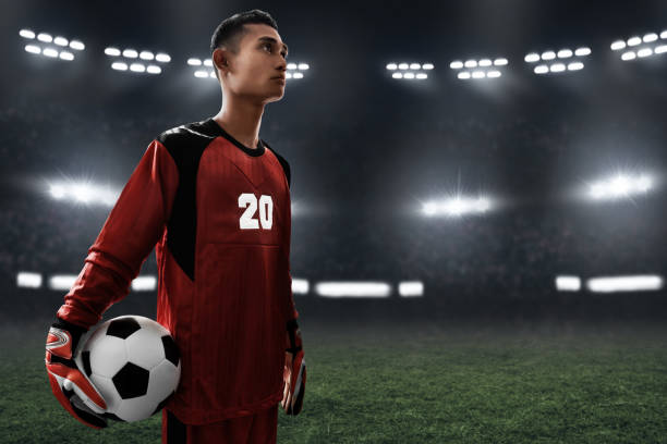 istock Soccer goalkeeper holding soccer ball 1001354812