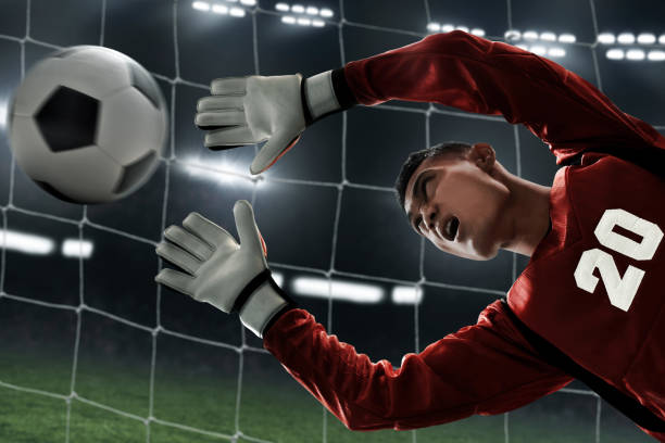 istock Soccer goalkeeper catches the ball 1001357736