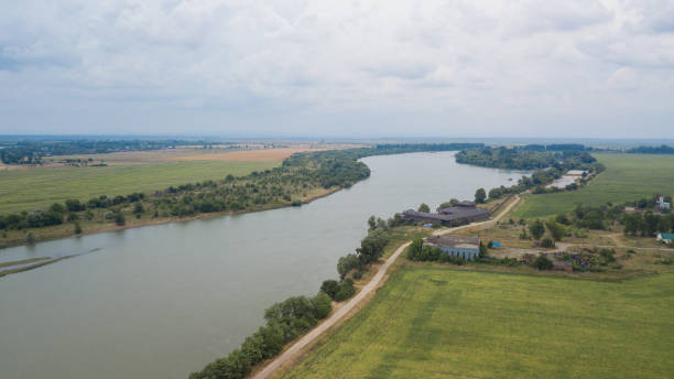 istock Russian forest, river, roads under blue sky by aerial drone. 1001357878