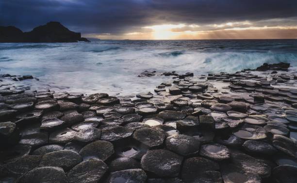 Hexed A storm lets loose at the Giant's Causeway, Ireland. giants causeway stock pictures, royalty-free photos & images