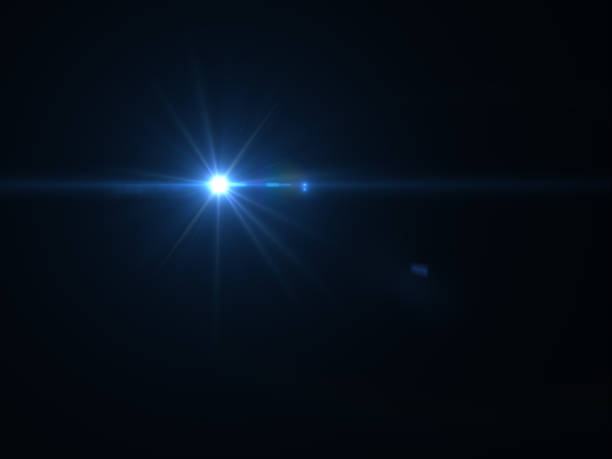 istock Abstract sun burst with digital lens flare light over black background 1001358754