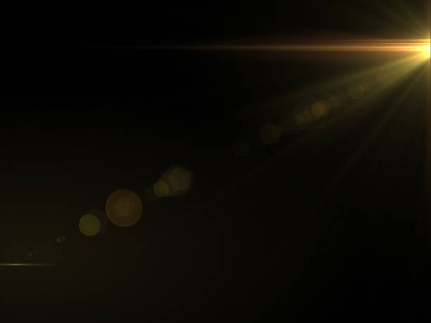 istock Abstract sun burst with digital lens flare light over black background 1001358768