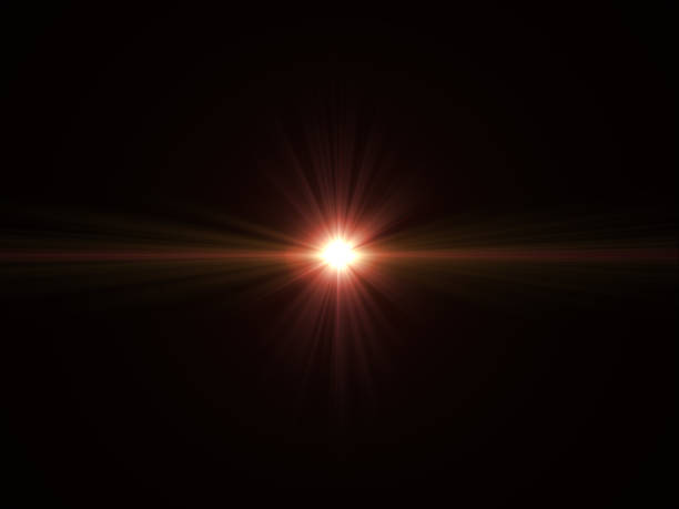 istock Abstract sun burst with digital lens flare light over black background 1001358782