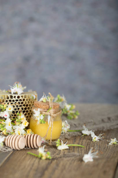 istock Chestnut honey on a wooden surface. 1001362846