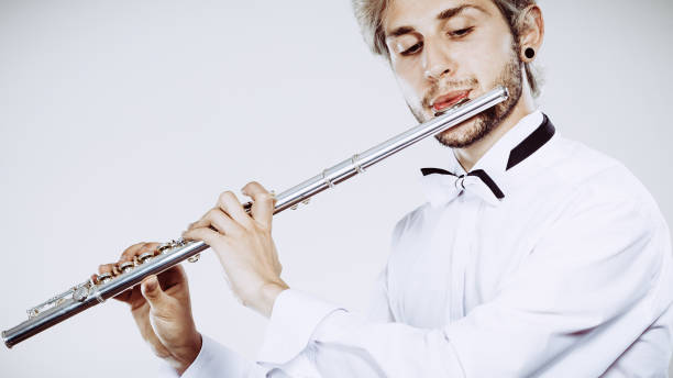 istock Male flutist playing his flute 1001367226