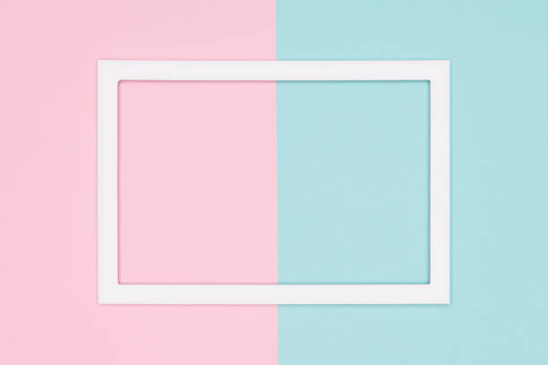 istock Abstract geometrical pastel blue and pink colored paper flat lay background. Minimalism template with empty picture frame mock up. 1001375244