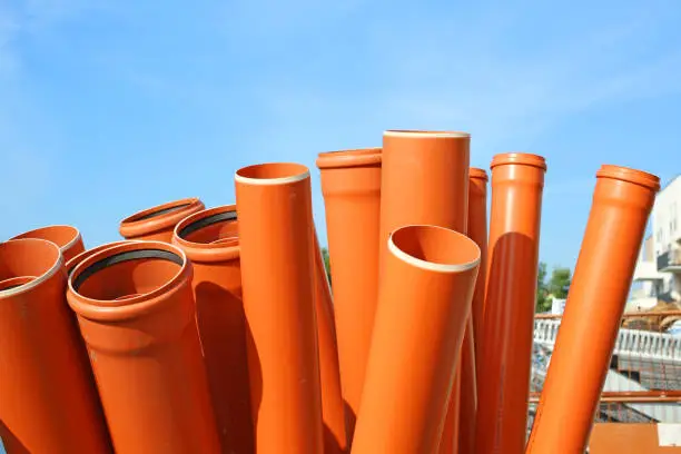 stack of sewer pipes on site