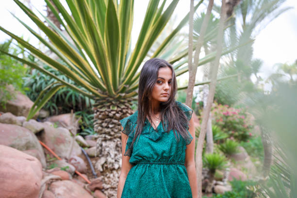 istock Chic girl in a long evening dress. 1001378690