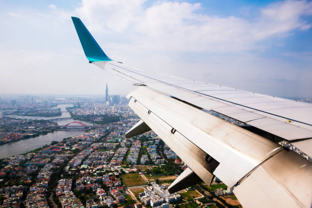 Vietnam cityscape view from airplane window. Vietnam cityscape view from airplane window,wing of plane over vietnam city. association of southeast asian nations photos stock pictures, royalty-free photos & images