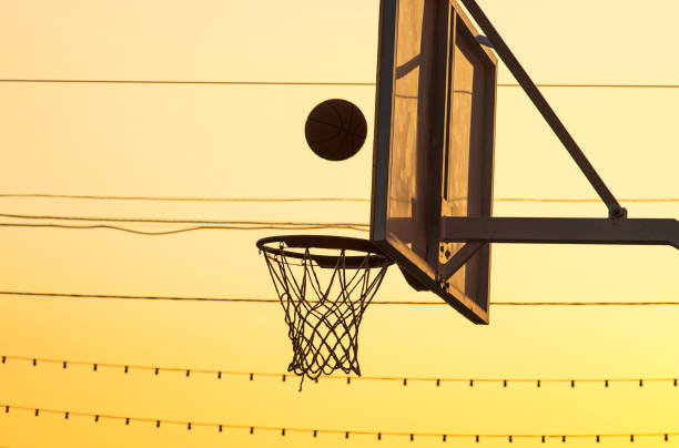 istock Basketball ring with a flying ball 1001379396